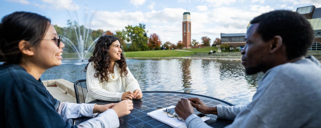 International students sitting together on campus